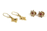 Lot 28 - A pair of Indian gold synthetic ruby and split pearl floral cluster earrings