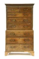 Lot 652 - An 18th century elm chest on chest