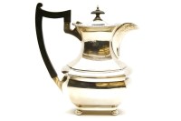 Lot 137 - A hallmarked silver teapot by Walker & Hall