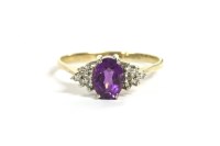 Lot 44 - A 9ct gold oval cut amethyst and diamond cluster ring
