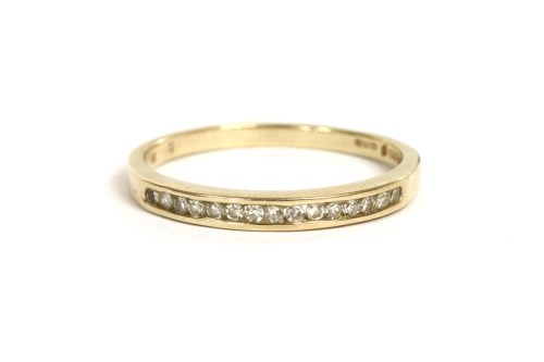 Lot 42 - A 9ct gold diamond half eternity ring