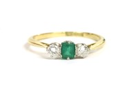 Lot 36 - A gold emerald and diamond three stone ring