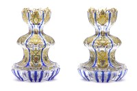 Lot 173 - A pair of cut blue glass bottle vases