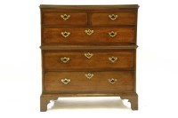 Lot 559 - A Georgian oak campaign style chest of two short over three long drawers