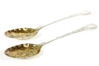 Lot 107 - A pair of George III hallmarked silver berry spoons