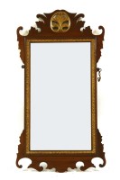 Lot 570 - A mahogany and gilt wall mirror
