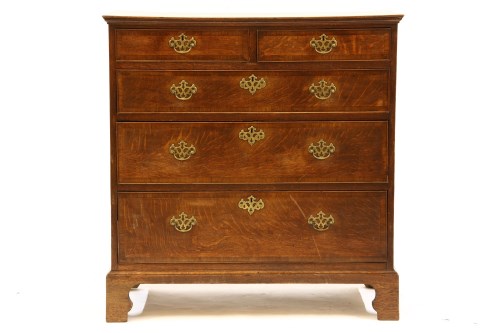 Lot 535 - A Georgian oak chest of two short over three long drawers