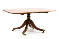 Lot 550 - A 19th century mahogany tilt top dining table