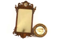 Lot 566 - A small Georgian gilt convex wall mirror
