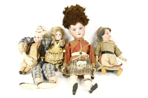 Lot 222 - Four small bisque head dolls