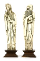 Lot 176 - A pair of Chinese carved ivory figures of scholars