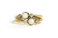 Lot 10 - Two three stone opal and diamond rings joined as one