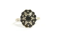Lot 11 - A sapphire and diamond cluster ring