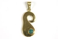 Lot 35 - An abstract shaped single stone cabochon turquoise pendant