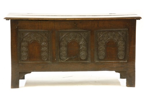 Lot 643 - An 18th century carved oak coffer
