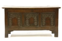 Lot 643 - An 18th century carved oak coffer