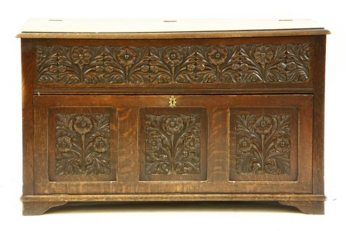 Lot 638 - A carved oak low cabinet