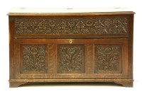 Lot 638 - A carved oak low cabinet