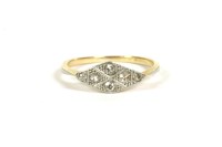 Lot 5 - An Art Deco gold four stone diamond lozenge shaped ring