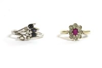 Lot 14 - A 9ct gold ruby and diamond cluster ring