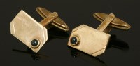 Lot 636 - A pair of 9ct gold single stone cabochon swivel back cufflinks