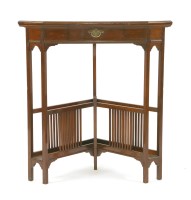 Lot 84 - A mahogany corner table