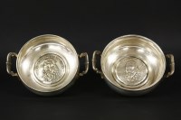 Lot 98 - A pair of Mexican Alpaca silver twin handled dishes with inset relief portraits of Miguel de Cervantes Saavedra