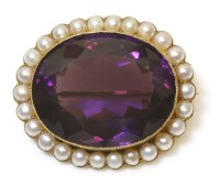 Lot 313 - An gold amethyst and split pearl brooch