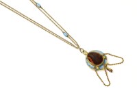 Lot 280 - A Victorian gold garnet and blue enamel pendant