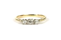 Lot 7 - A gold three stone diamond ring