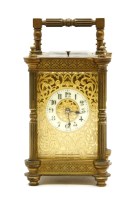 Lot 123 - A late 19th to early 20th century brass carriage clock