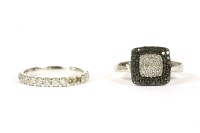 Lot 127 - A white gold cushion shaped diamond and black diamond cluster ring