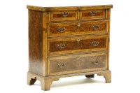 Lot 502 - A George II style walnut folder-over top bachelors chest