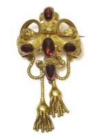 Lot 283 - A Victorian Gothic-style cabochon garnet swag and tassel brooch