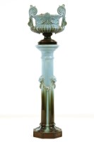 Lot 354 - A late 19th century twin handled turquoise glazed jardinière on pedestal