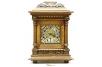 Lot 287 - An early 20th century oak cased eight day mantel clock
