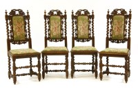 Lot 540 - A set of four Jacobean style carved oak dining chairs