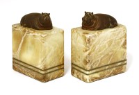 Lot 202 - A pair of patinated bronze and alabaster bookends