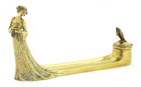 Lot 76 - An Art Nouveau brass inkstand