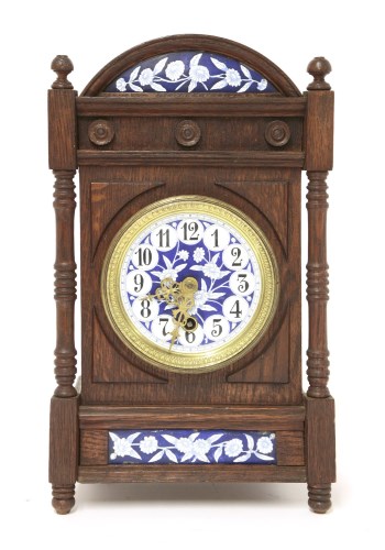 Lot 17 - An Aesthetic oak and enamelled mantel clock