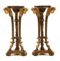 Lot 517 - A pair of Regency design walnut and parcel gilt torcheres