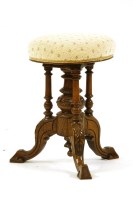 Lot 455 - A Victorian walnut adjustable piano stool