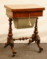 Lot 475 - A Victorian figured walnut games work table