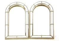 Lot 532 - A pair of arch form wall mirrors
