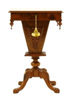 Lot 534 - A Victorian figured walnut work table