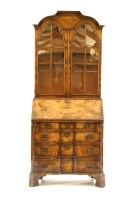 Lot 439 - A Queen Anne design walnut bureau bookcase