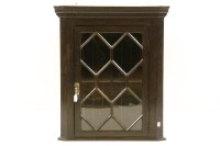 Lot 445 - An oak hanging corner cabinet