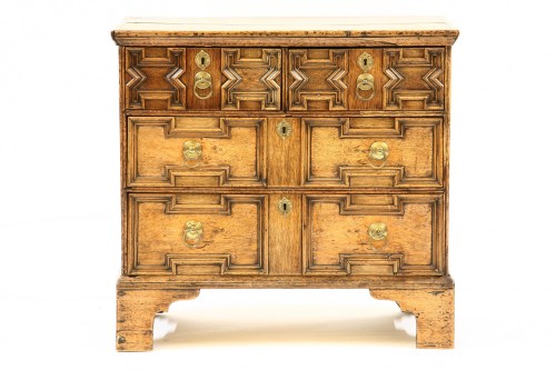 Lot 437 - An 18th century oak geometrically moulded chest of drawers