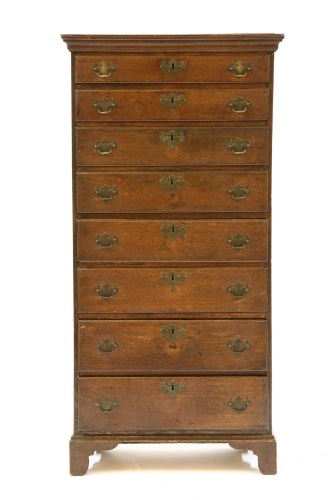 Lot 515 - An 18th century oak tall chest of eight drawers