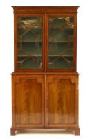 Lot 443 - A Georgian mahogany bookcase cabinet